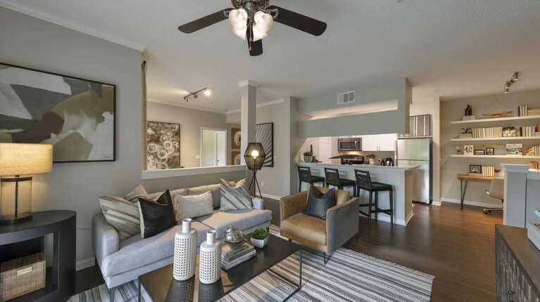 Spacious living room with ceiling fan