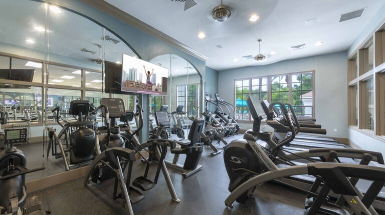 24-hour fitness center with cardio and strength equipment